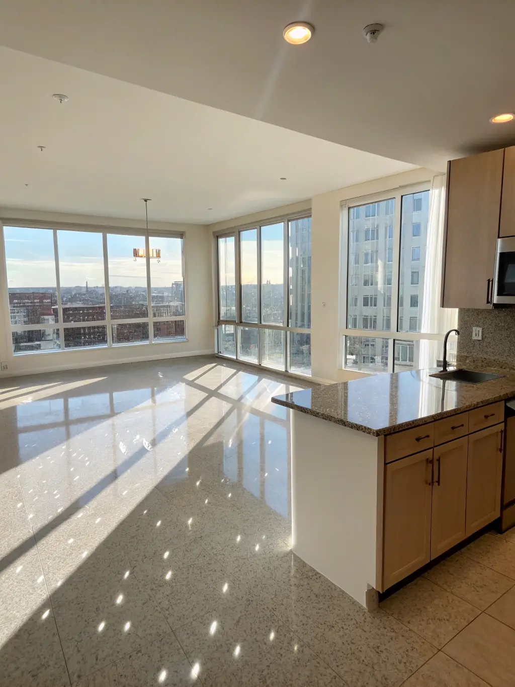 An inviting photo of a freshly cleaned apartment ready for move-in, highlighting the pristine condition of floors and windows.